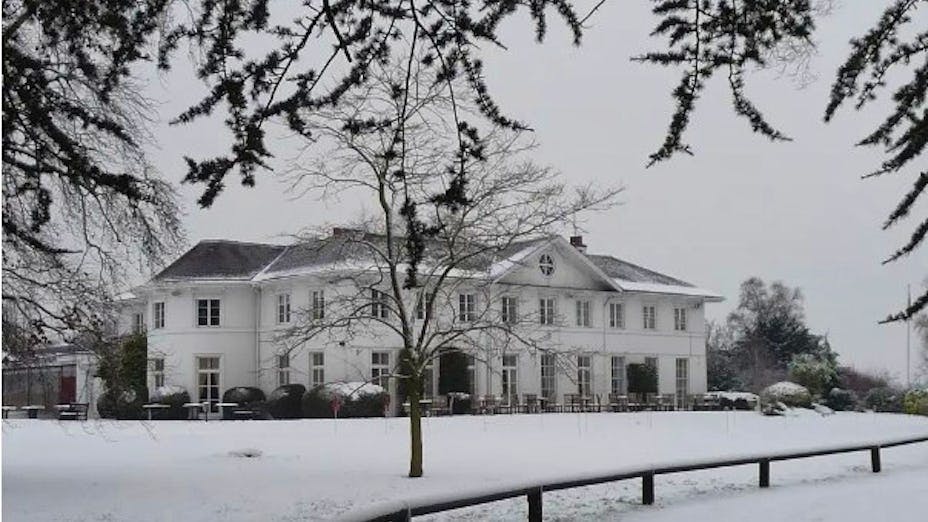 Grand Hall at Dyrham Park, snow-covered venue for winter retreats and gatherings.