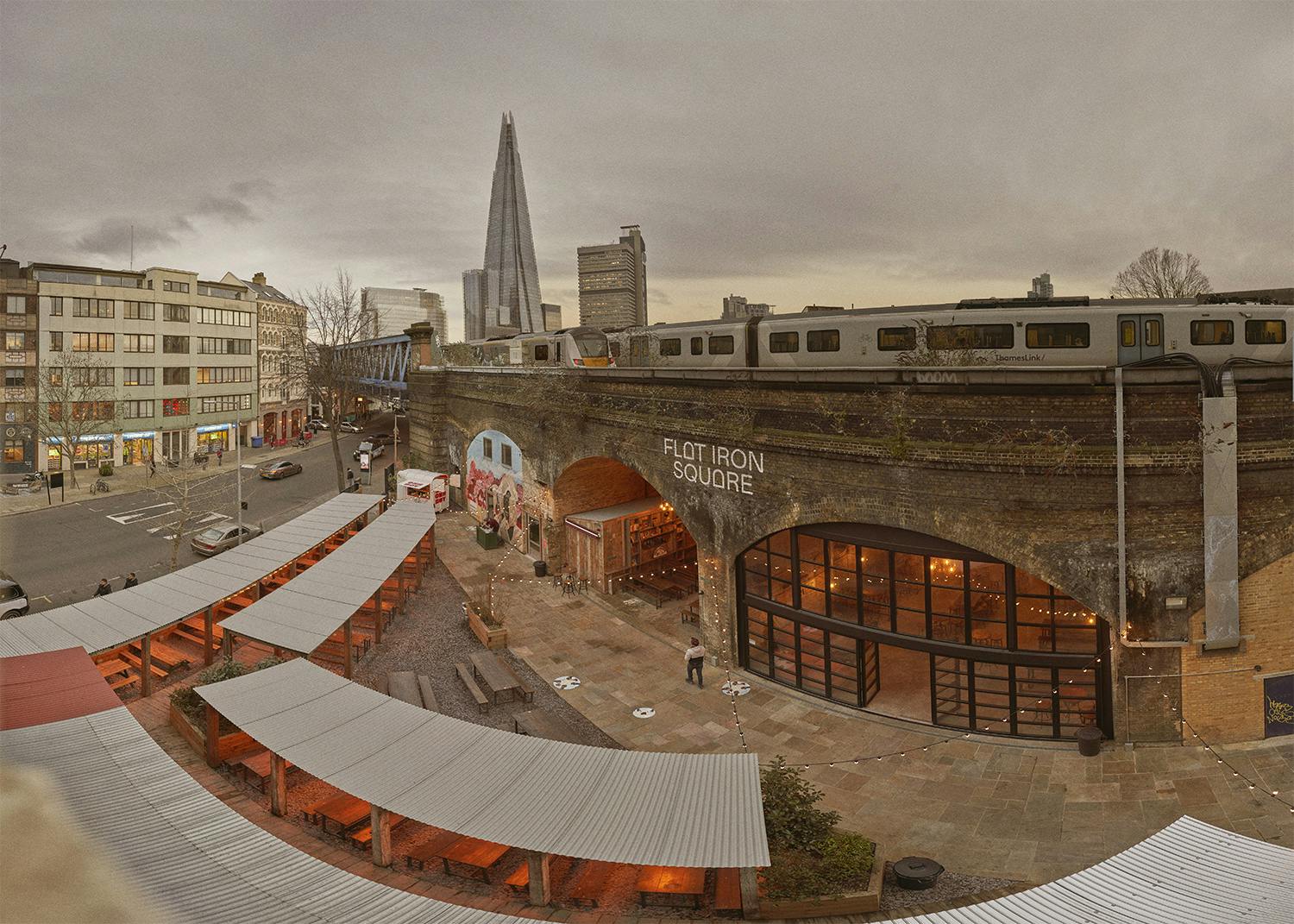 Flat Iron Square venue with historic arches, perfect for events and gatherings.
