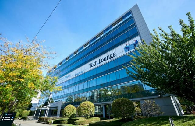 Modern corporate building with glass facade, ideal for meetings and networking events.