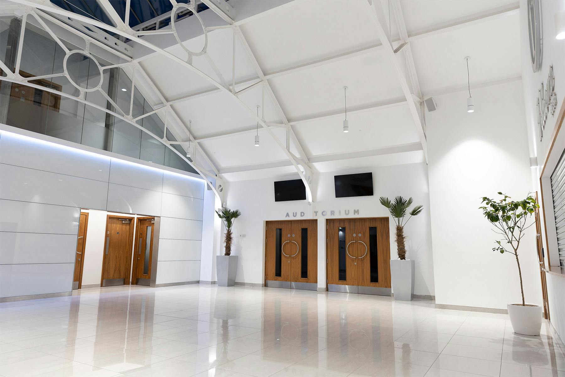 Modern event foyer with high ceilings at The Tab Centre & HQ, ideal for meetings.