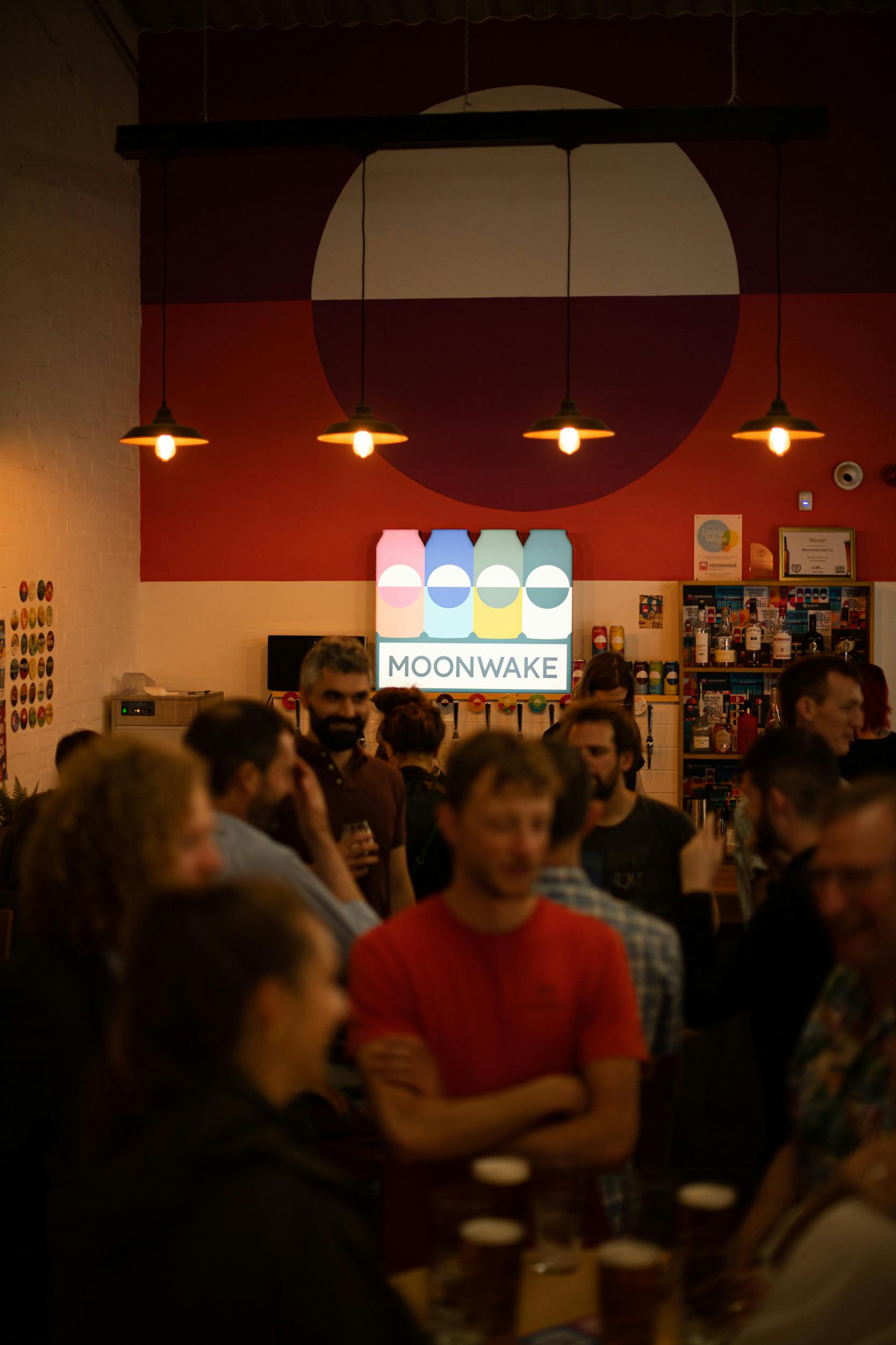 Vibrant social gathering at Moonwake Taproom's Back Bar, ideal for networking events.