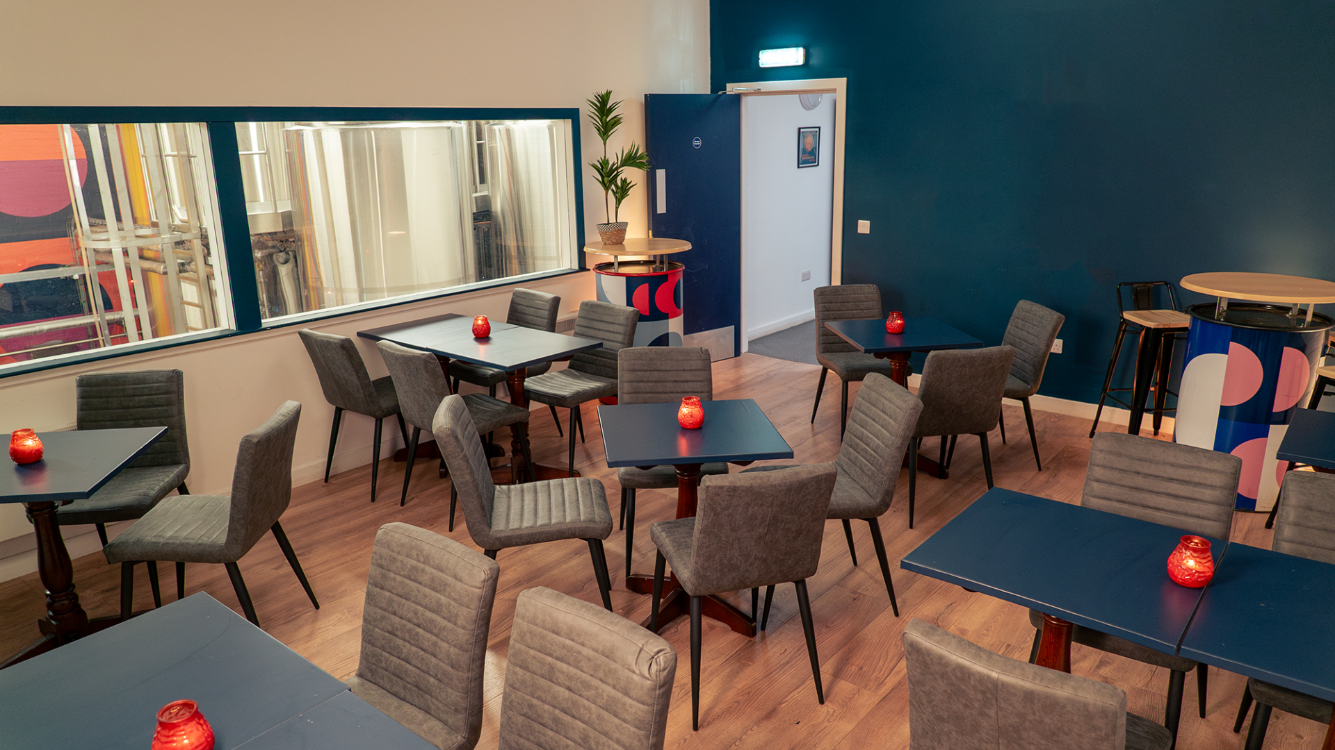 Modern event space at Moonwake Taproom with warm lighting for gatherings and meetings. - Banner