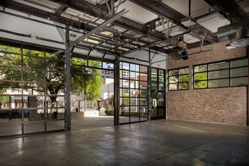 Versatile event space at 800 Congress with large windows for corporate meetings and gatherings.