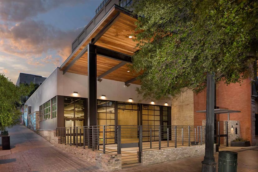 Modern event venue with glass doors, ideal for corporate meetings and social gatherings.