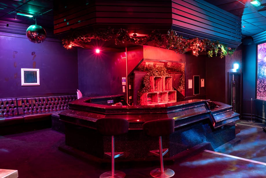 Stylish Kuda York bar with vibrant lighting, perfect for networking and events.