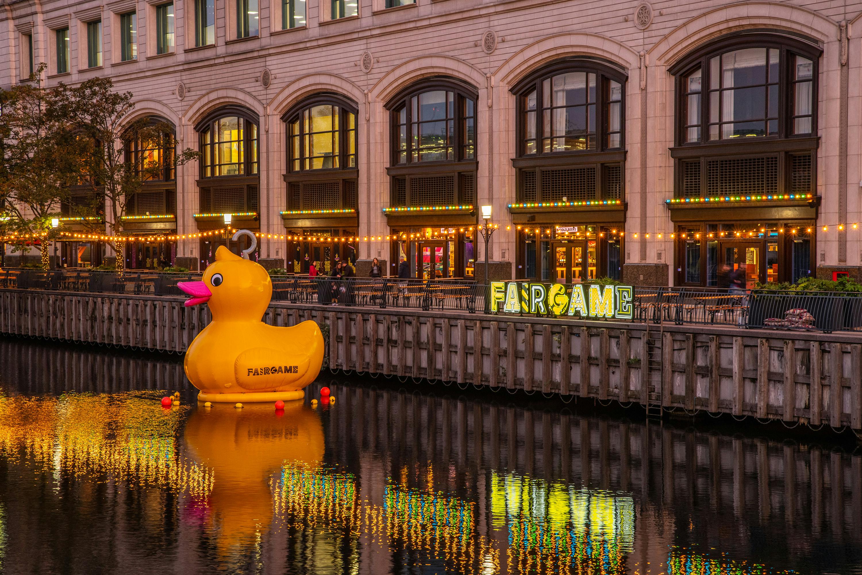 Vibrant Summer Terrace event space with inflatable rubber duck and illuminated signage.