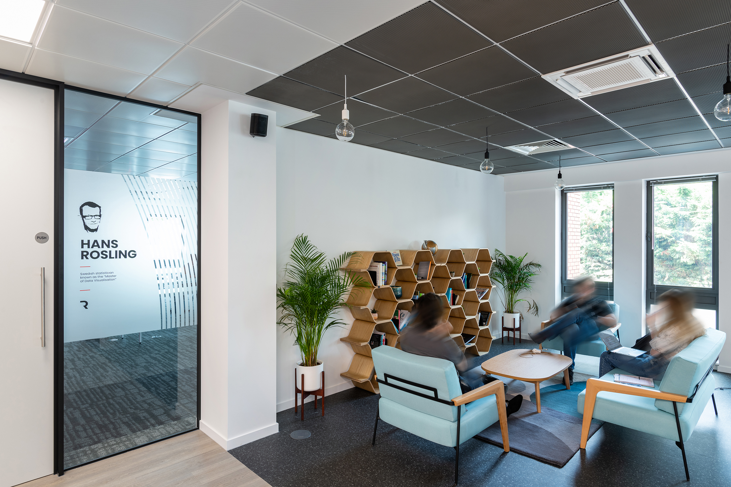Modern meeting space in Melbury House with glass door, ideal for brainstorming sessions. - Banner