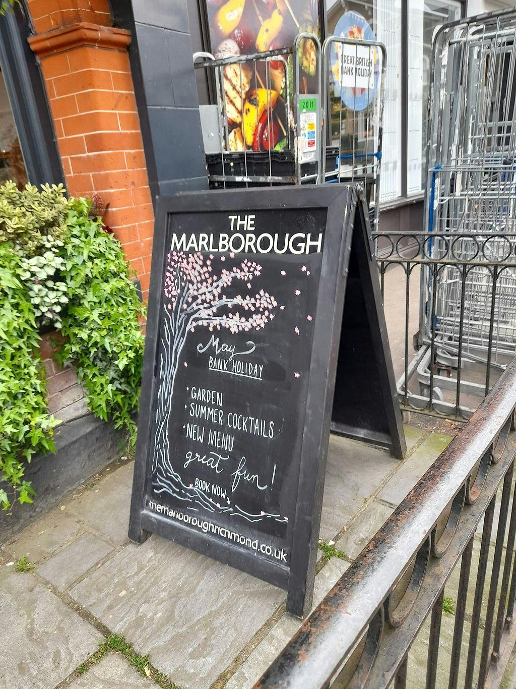 Garden venue sign promoting summer cocktails and events at The Marlborough Richmond.