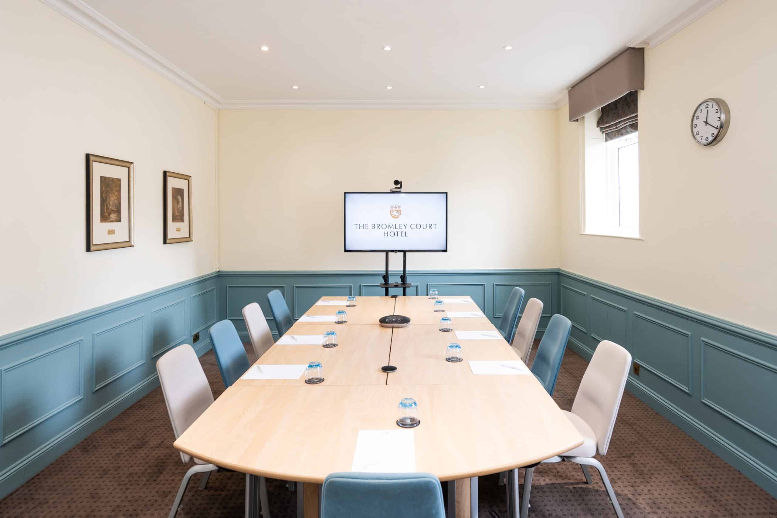 Seminar room at Bromley by Bow Centre, featuring a long table for corporate meetings. - Banner