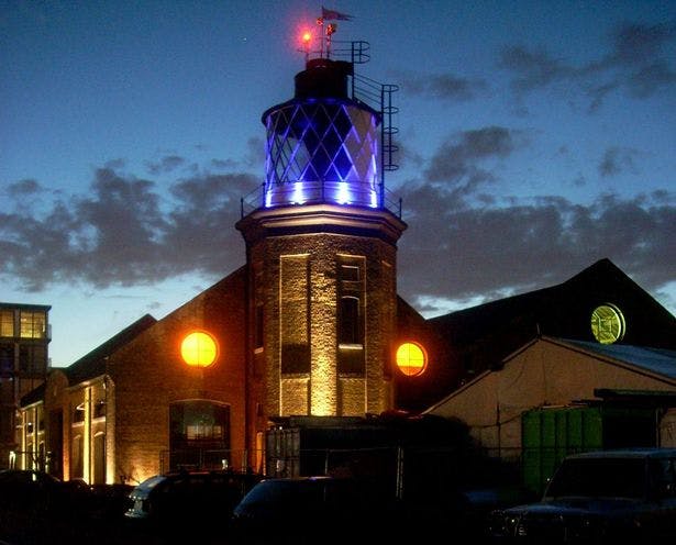 Music Boxes at Trinity Buoy Wharf, illuminated venue for evening events with unique architecture.