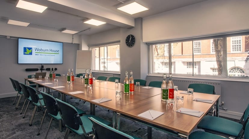 Brunswick Room in Woburn House, set for a professional meeting with natural light.