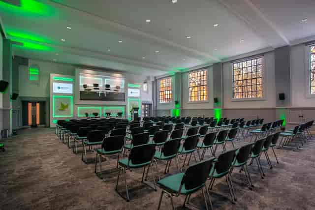 Modern UUK Boardroom with AV setup for corporate presentations and panel discussion events.