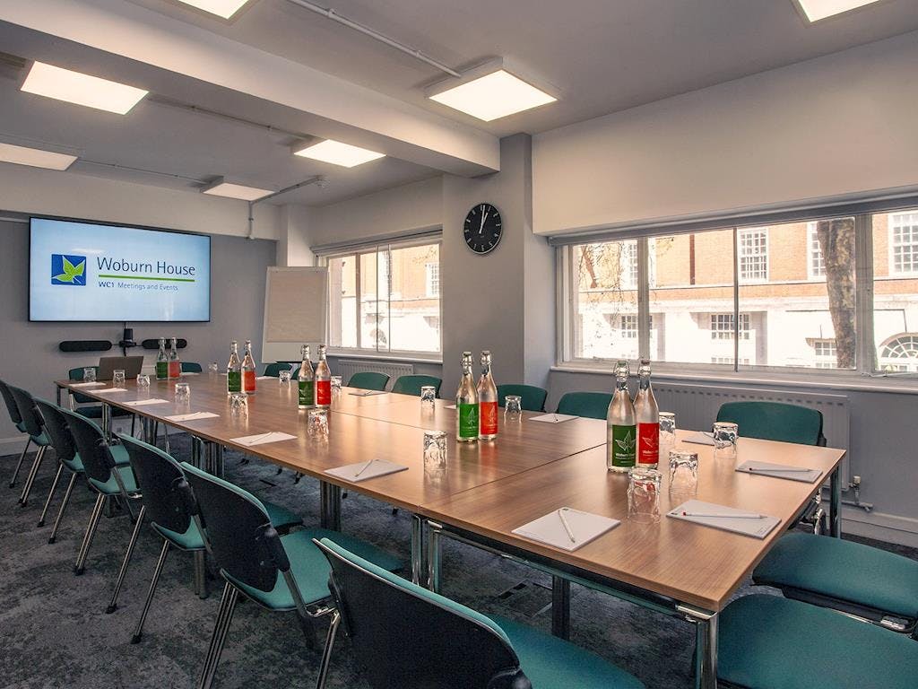 UUK Boardroom in Woburn House, set for professional meetings with natural light.