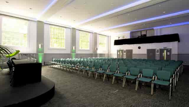 UUK Boardroom theater-style plenary space for corporate presentations and academic lectures.