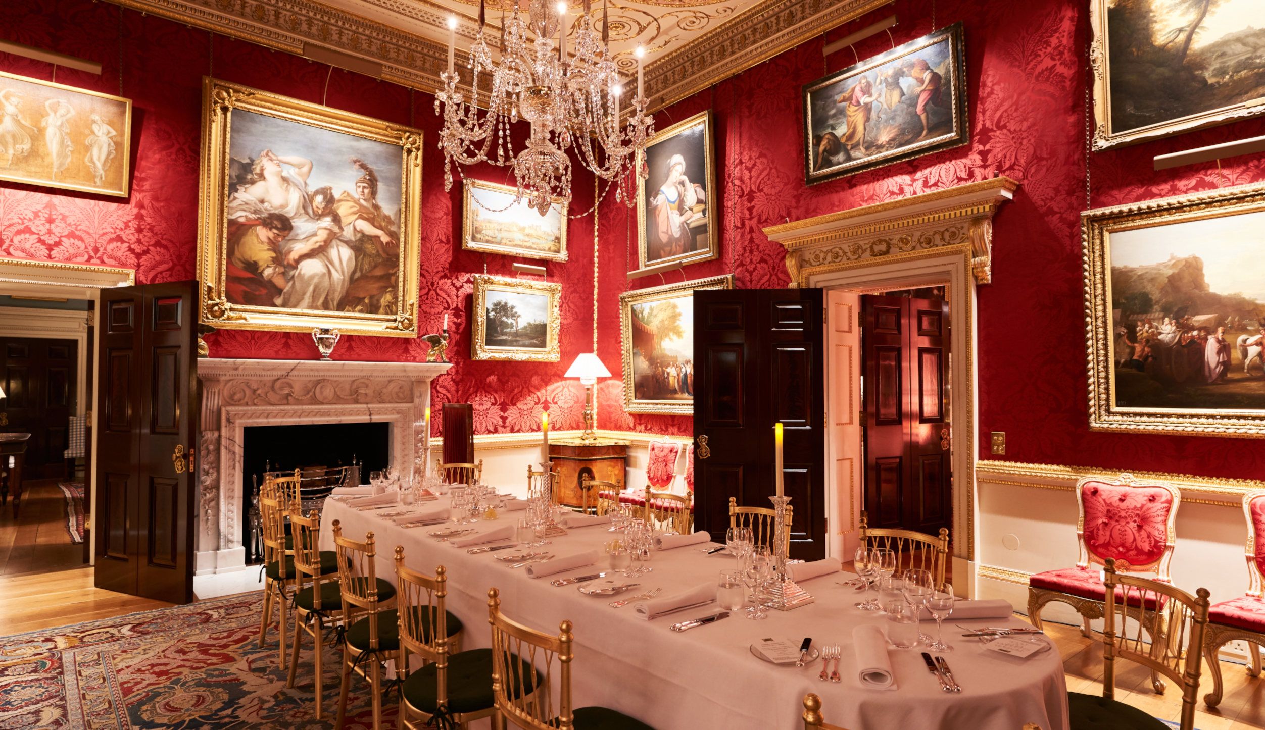 Elegant dining room in Spencer House, set for formal events with fine tableware. - Banner