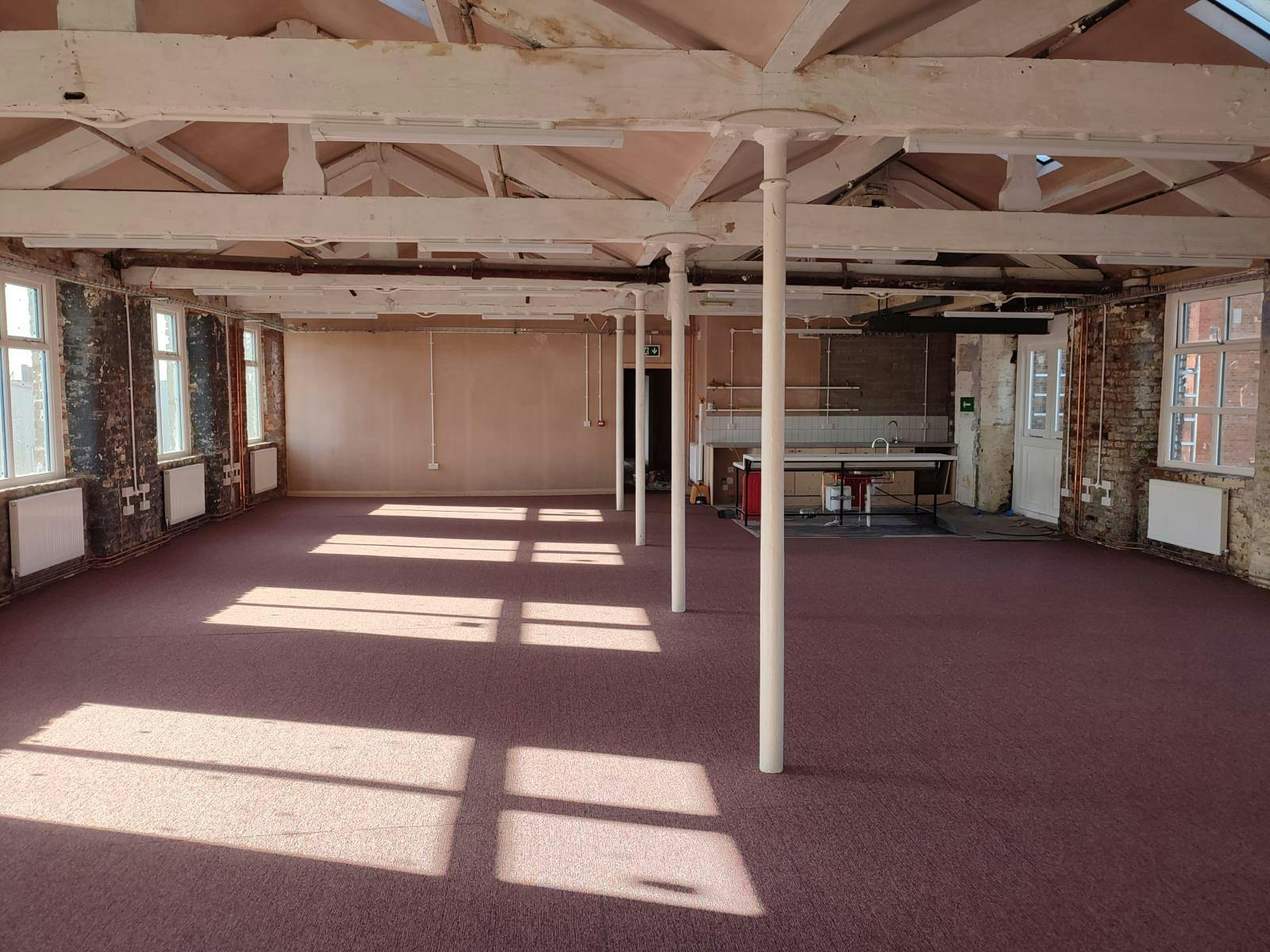 Spacious New Islington Mill venue with high ceilings, ideal for events and workshops.