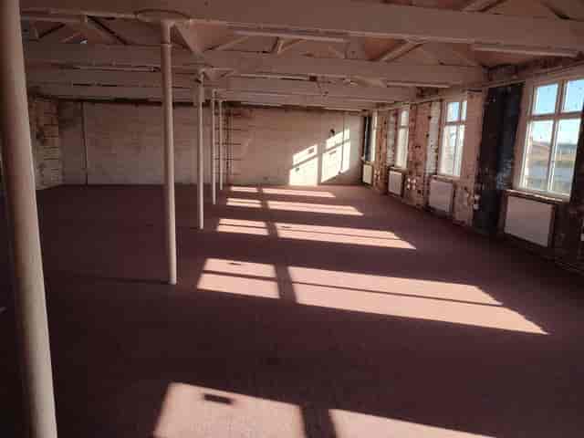 Spacious New Islington Mill venue with natural light, perfect for creative events and workshops.