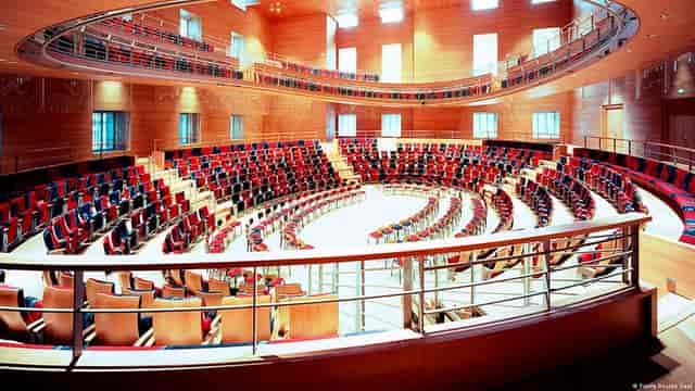 Modern concert hall with tiered seating, perfect for conferences and presentations.