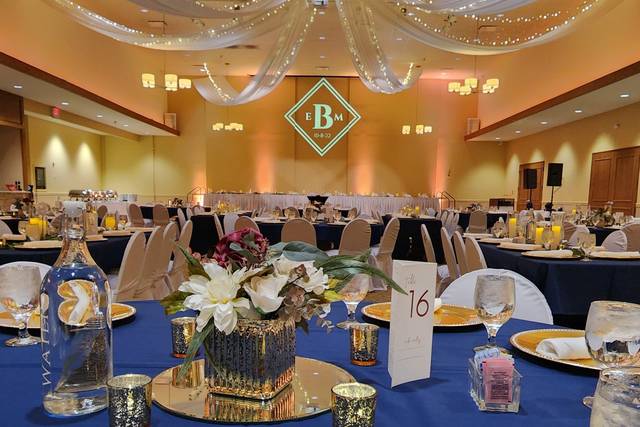 Elegant navy and gold banquet hall setup for corporate events and celebrations.