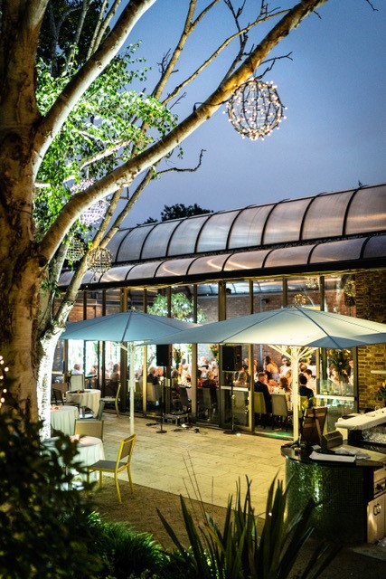 Outdoor dining space at The Conservatory, ideal for events and gatherings. - Banner
