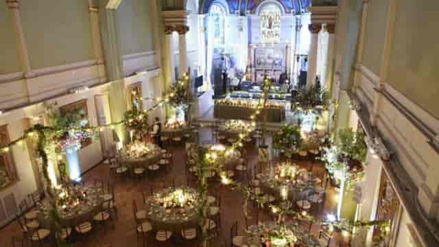 Elegant event space in Soane Hall with floral centerpieces, perfect for weddings.