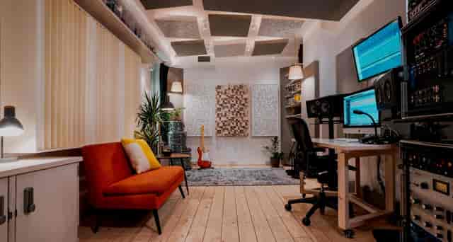 Modern recording studio with dual monitors, ideal for virtual events and workshops.