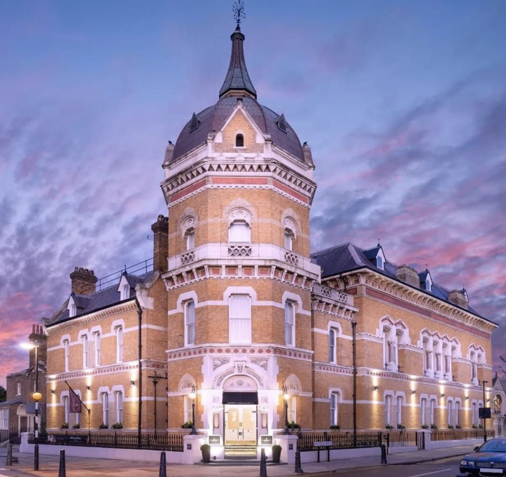 Historic Lansbury Heritage Hotel terrace with unique tower, ideal for elegant events. - Banner