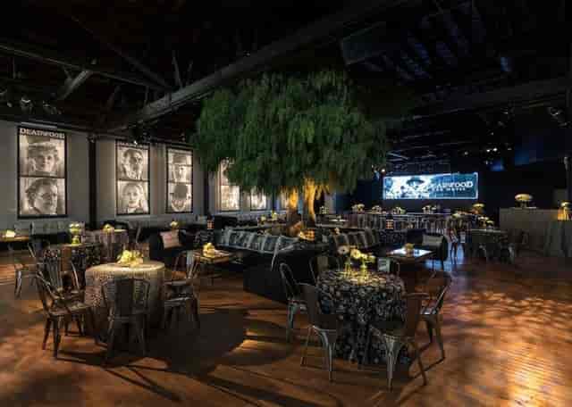 Elegant event space with floral centerpieces, ideal for networking and celebrations.
