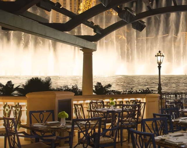 Elegant outdoor patio venue with fountain, perfect for upscale receptions and gala dinners.