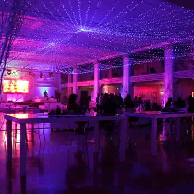 Penthouse event space in Casa Vertigo with colorful lighting for networking and celebrations.