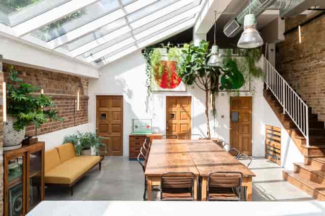 Inviting meeting room with wooden table for workshops at Paper Mill Studio, Tastemade.