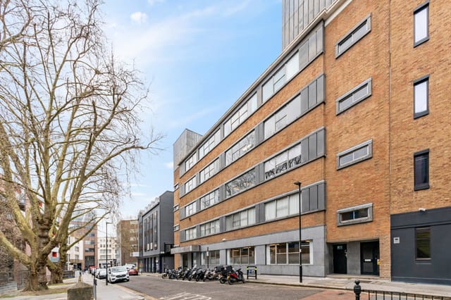 Modern Meeting Room 3 with large windows, ideal for corporate events and workshops.