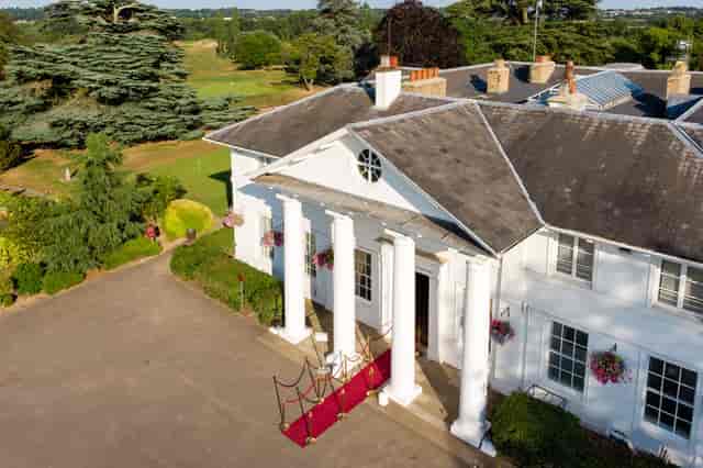 Elegant Dyrham Park Country Club bridge with classic columns, perfect for upscale events.