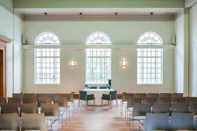 Elegant meeting space in Hackney Venues with large windows for events and presentations.