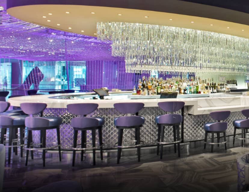 Chandelier Lounge bar at Cosmopolitan, stylish seating for networking events and gatherings.