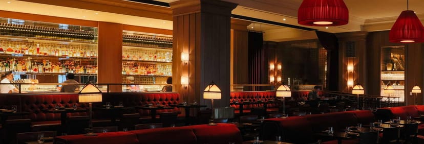 Sophisticated NoMad Bar with plush seating, ideal for corporate events and private dinners.