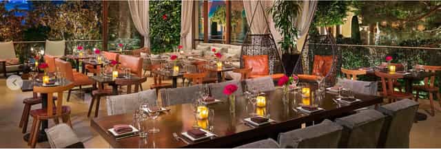 Elegant dining room with candlelight, perfect for corporate events and intimate gatherings.
