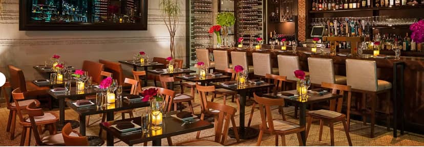 Sophisticated dining room with wine display, ideal for corporate events and wine tastings.