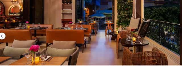 Stylish restaurant dining room with elegant decor for intimate gatherings and corporate events.