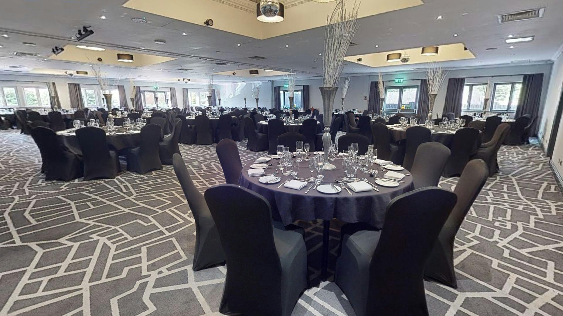 Inspiration 2 event space in Cardiff with elegant round tables and modern decor.