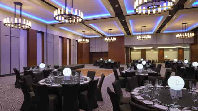 Elegant event space with black linens, perfect for corporate dinners and weddings.