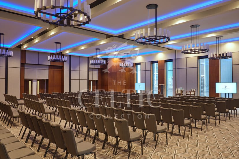 Modern event space with blue lighting, ideal for corporate meetings and social gatherings.
