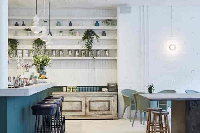 Private dining room with minimalist decor, ideal for intimate gatherings and networking events.