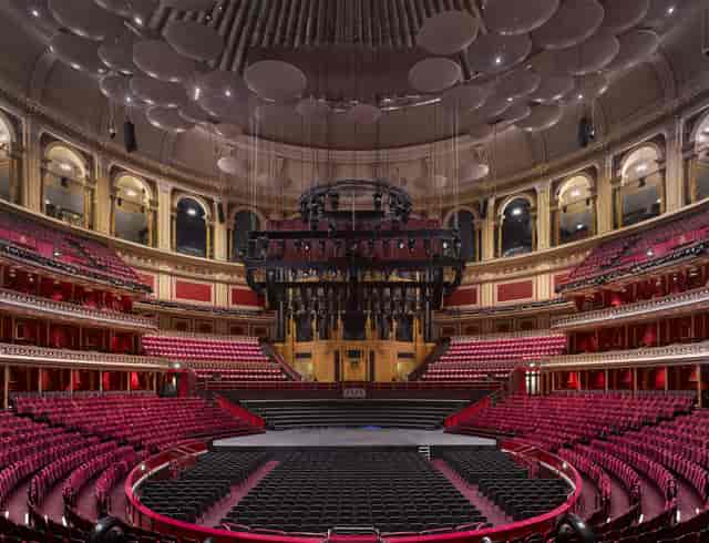 Royal Albert Hall concert venue with tiered seating and grand stage for events.