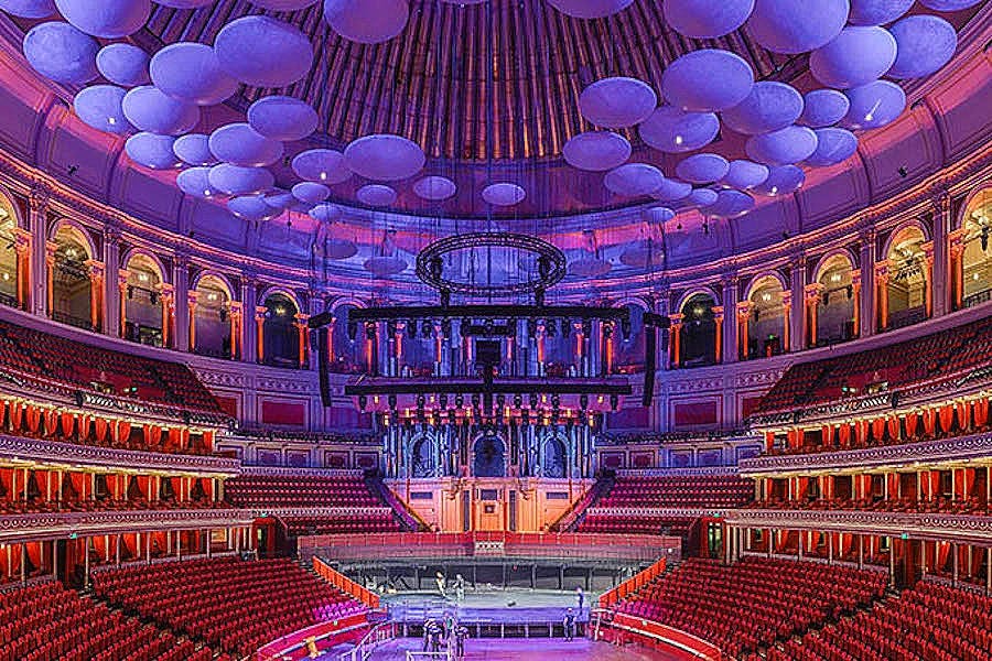 Royal Albert Hall concert venue with grand architecture and vibrant lighting.