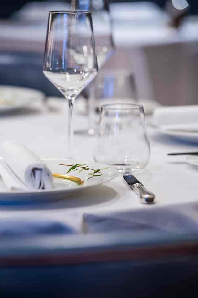 Elegant dining table setup at Bentley's Oyster Bar for formal events.