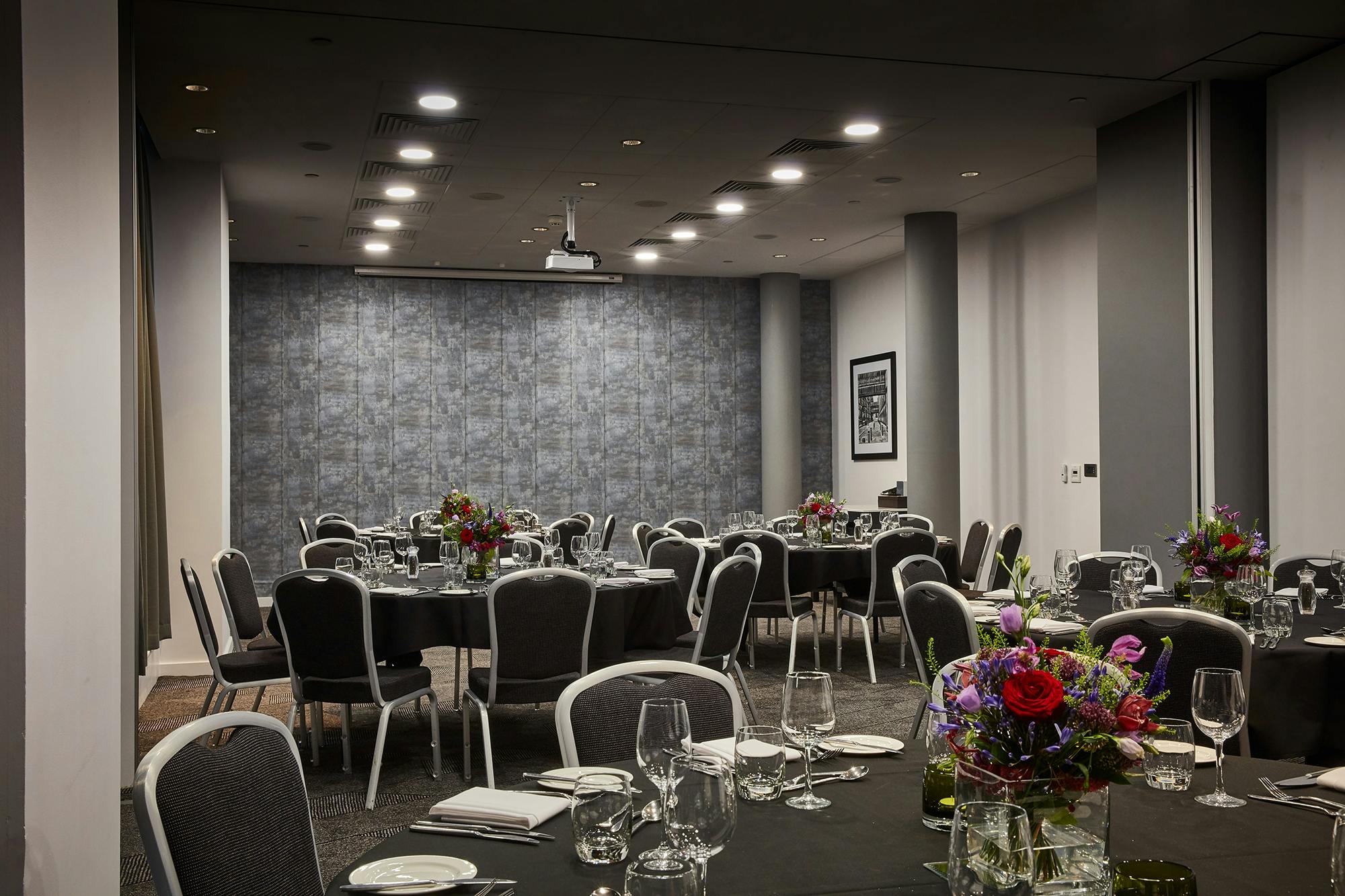 Elegant event space at DoubleTree by Hilton Manchester with round tables for gatherings.