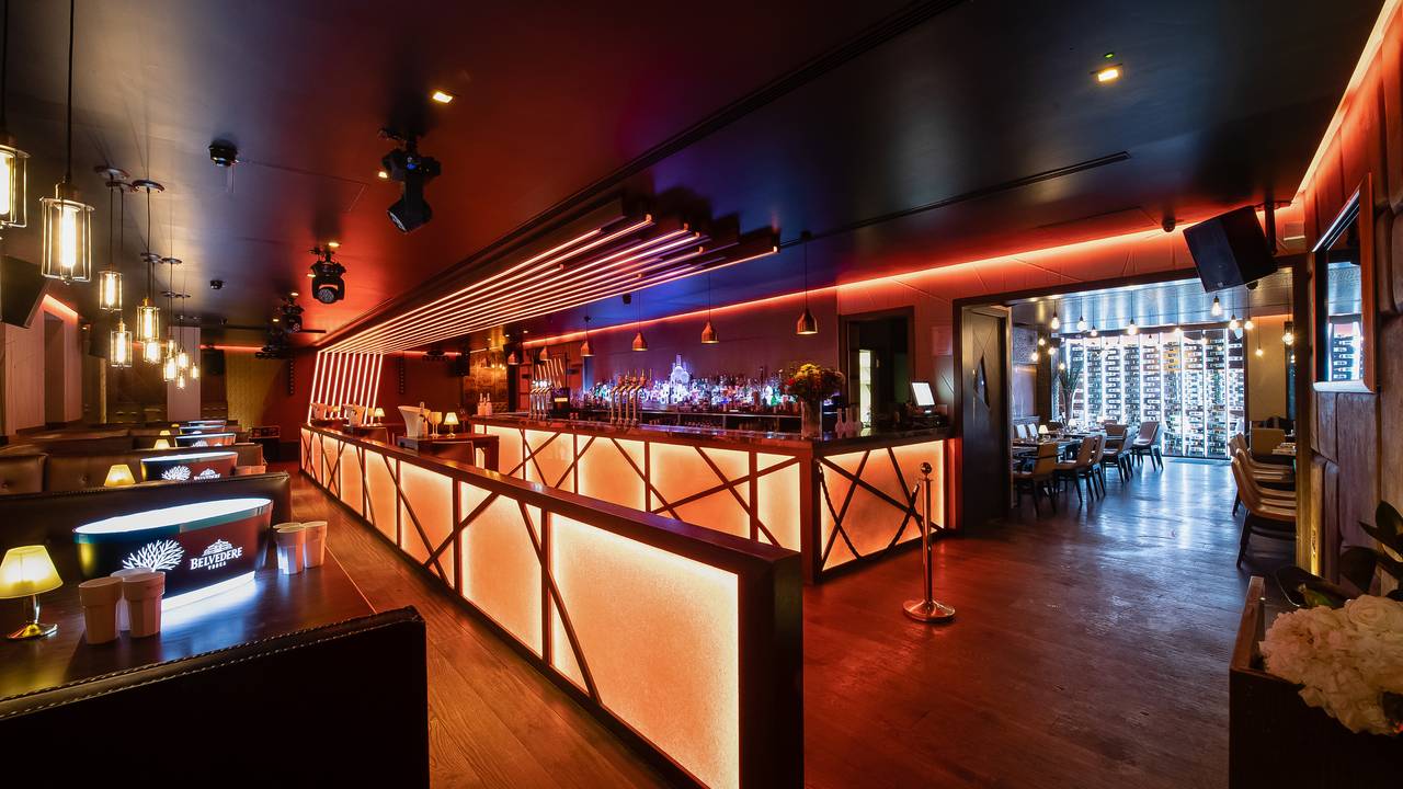 Modern Internet Cafe at The Harrow Club, vibrant bar, ideal for events and gatherings. - Banner