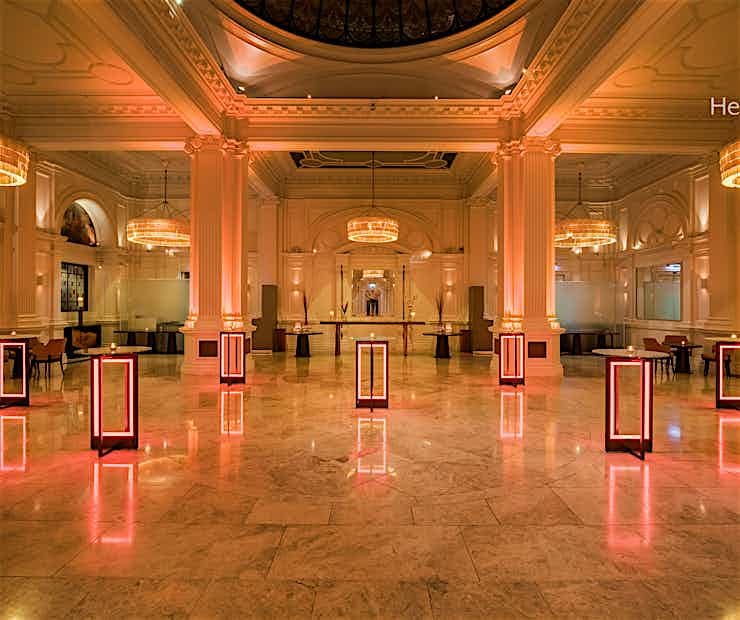 Elegant ballroom with ambient lighting, perfect for networking and cocktail receptions.