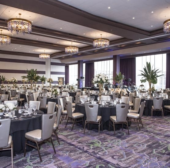 Elegant event space with round tables, ideal for weddings and corporate gatherings.